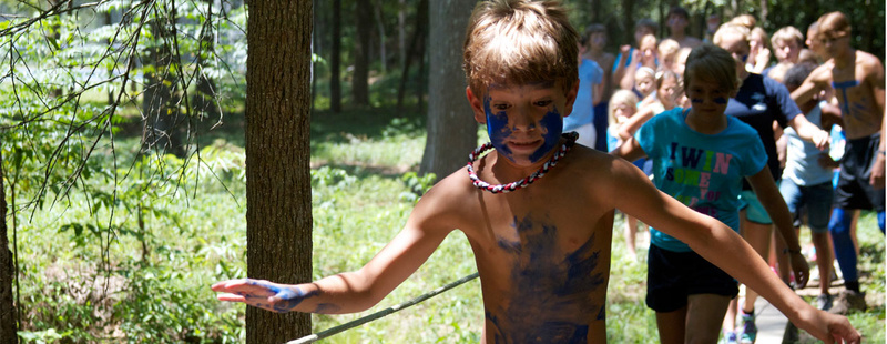 Obstacle Course - race through the Pineywoods and beat your personal best OC time! Zachary (1st yr, 2nd gen camper) leads the Tejas across the foot bridge.