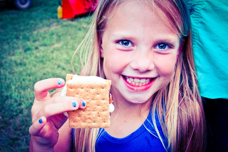 Caitlin (2 yrs at camp, 2nd generation camper) puts the cute in smores as she gets ready to take a big bite after Fishing.
