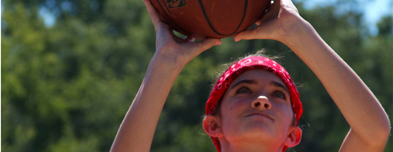 Hot Shot Basketball - how many points can you score in one minute? Amber (4 yrs at camp) eyes a free throw.