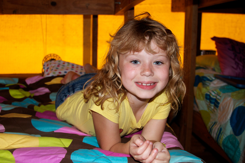 Taylor (1st yr at camp, 2nd generation camper) smiles big in Willow Glen, where 7yr old girls get to spend their first summer! 